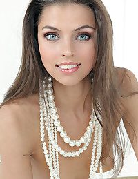 Classic white setting graced by an elegantly beautiful brunette.